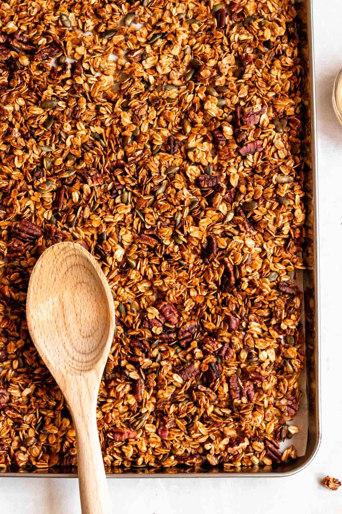 Overhead shot of granola in a baking pan.