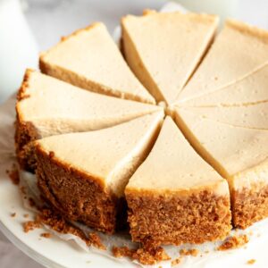 Vanilla cheesecake on a cake platter.