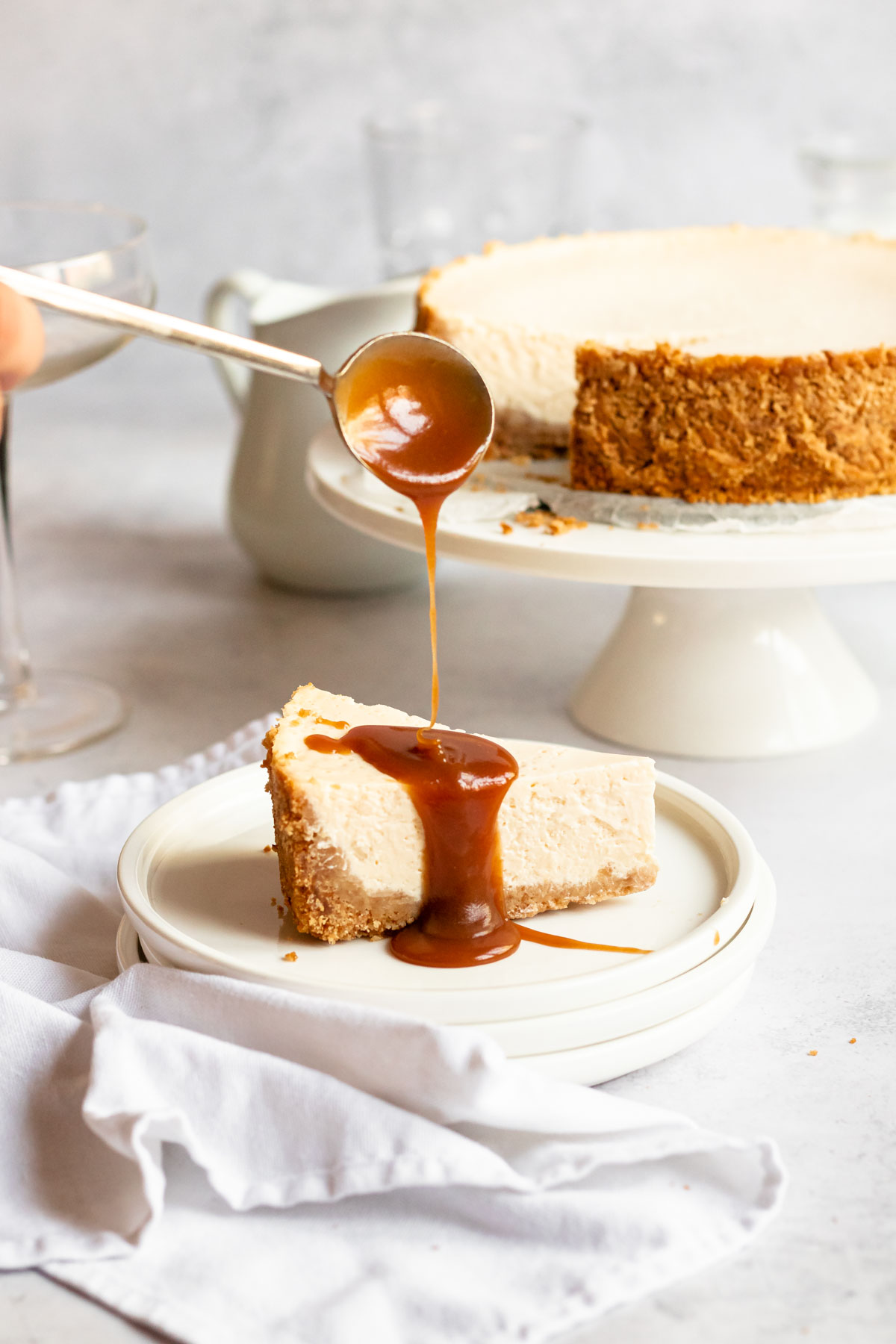 Caramel drizzled over a slice of cheesecake.