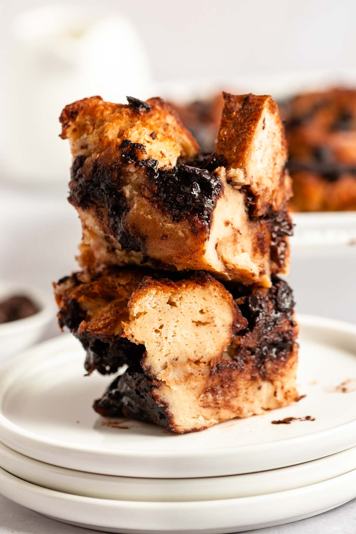 Stack of two sliced of chocolate chip bread pudding.