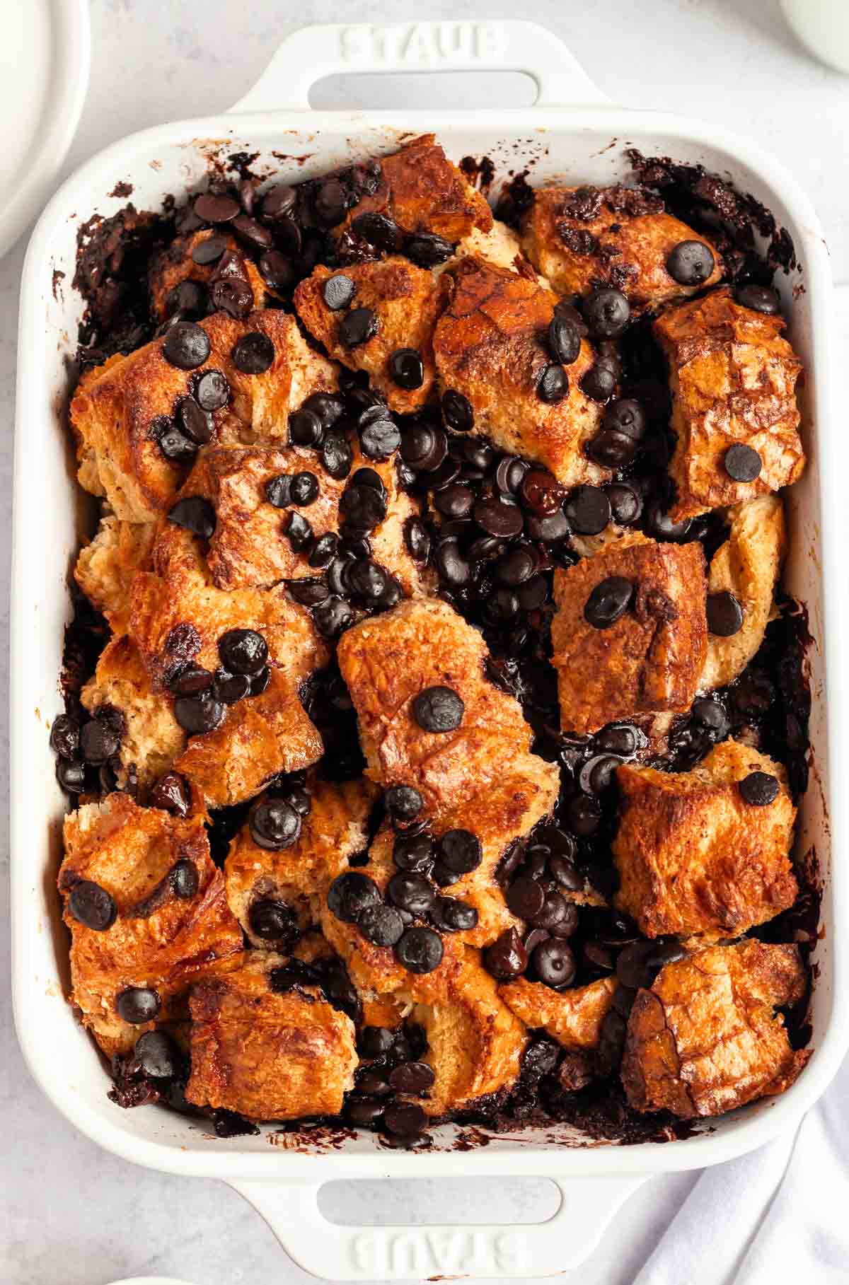 Overhead shot of bread pudding with chocolate chips.