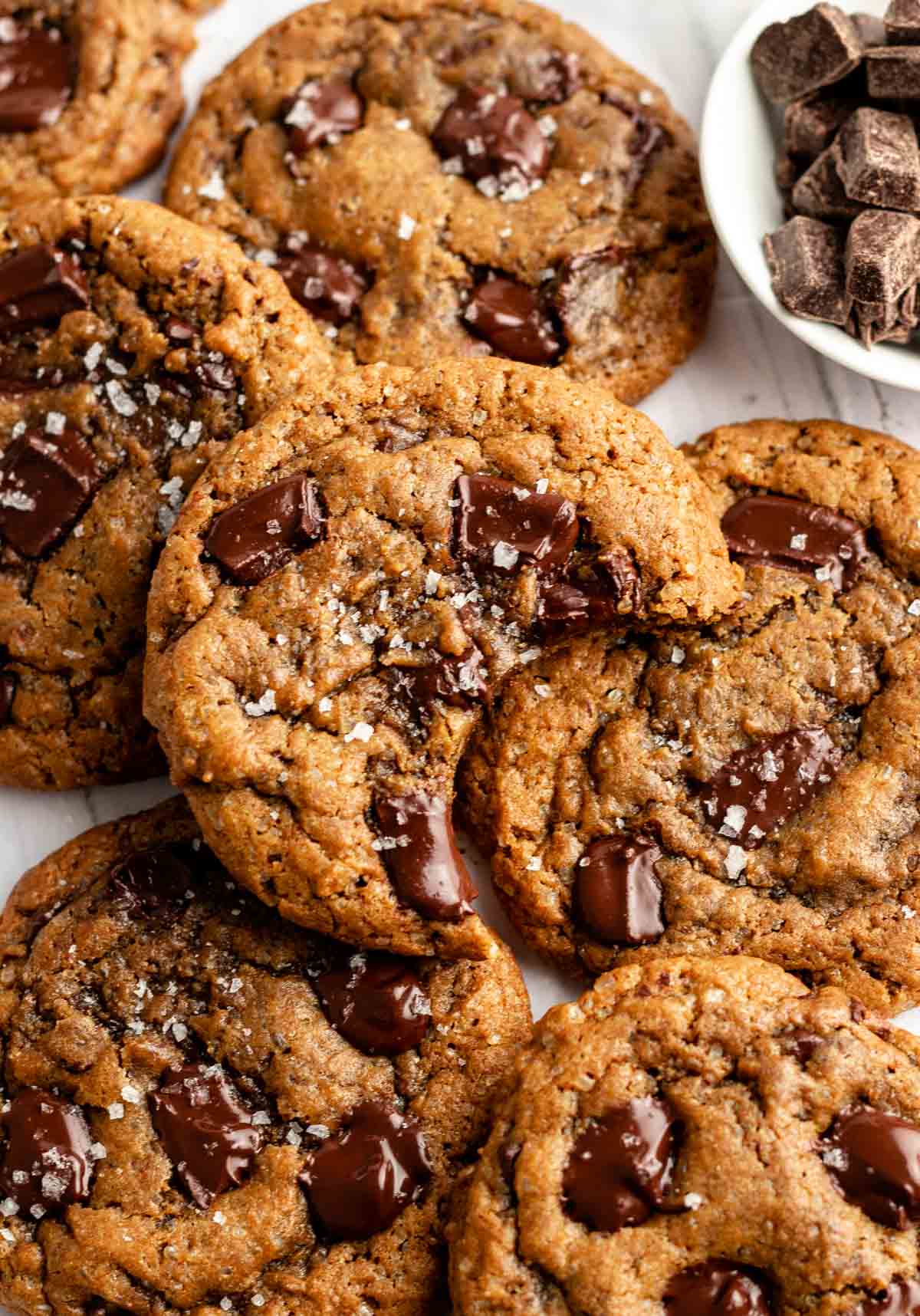 Overhead shot of coffee cookies with the middle one missing a bite.