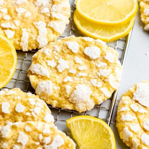 Lemon crinkle cookies on a cooling rack.