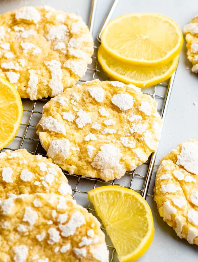 Lemon crinkle cookies on a cooling rack.