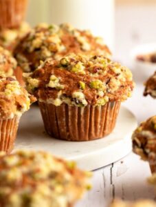 Close up shot of pistachio muffins with pistachio crumble.