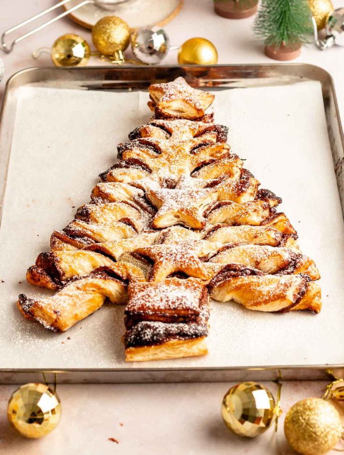 Puff pastry Nutella christmas tree on a parchment paper lined baking sheet.