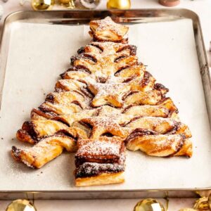 Puff pastry Nutella christmas tree on a parchment paper lined baking sheet.