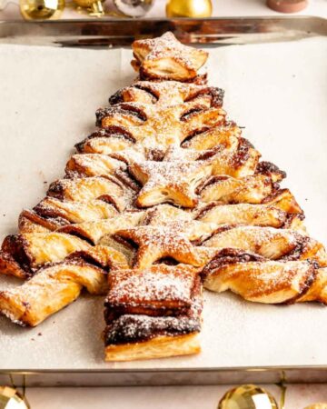 Puff pastry Nutella christmas tree on a parchment paper lined baking sheet.