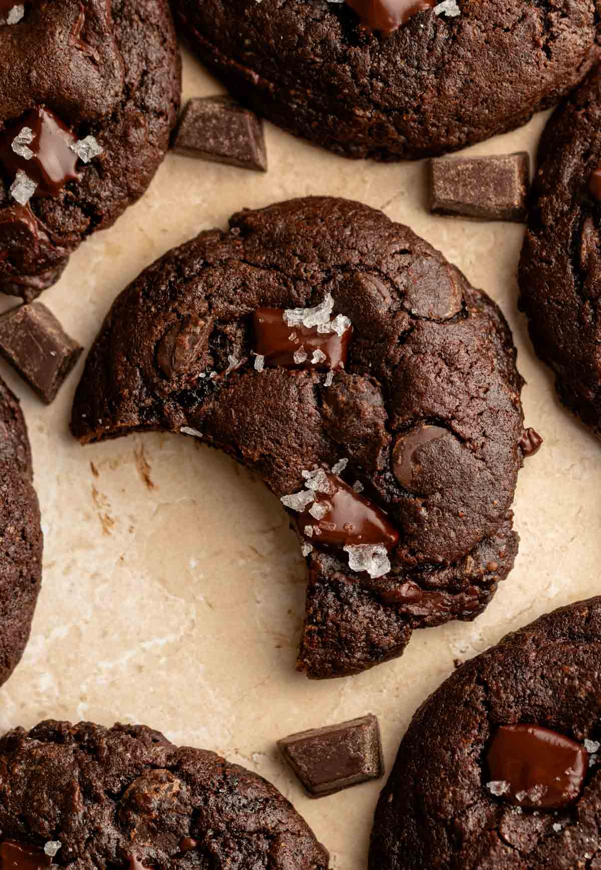 Bite missing from a chocolate cookie.