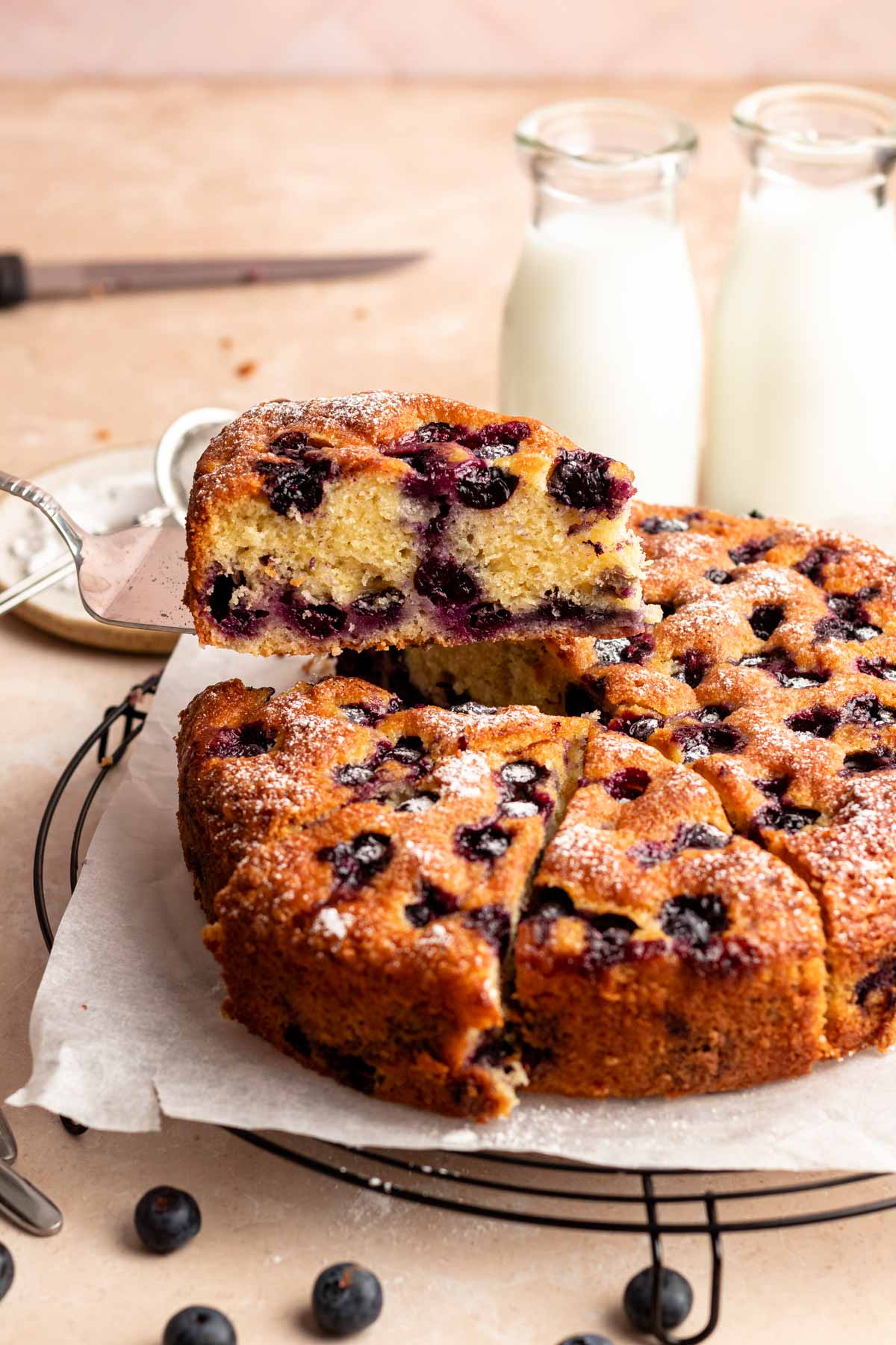 Slice pulled out from a blueberry cake.