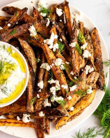 Overhead shot of greek fries on a plate.