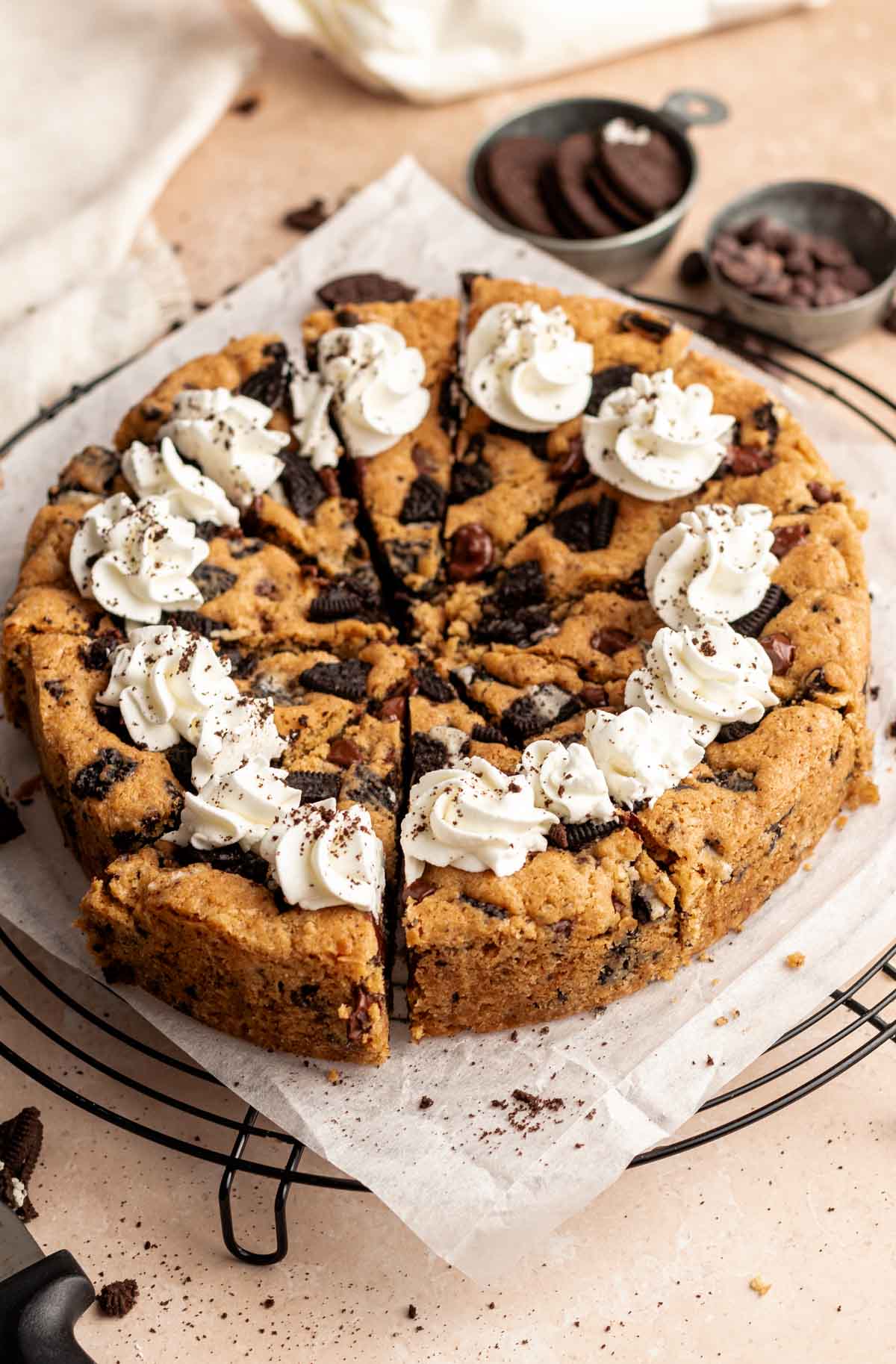 Oreo cookie cake on a cooling rack.