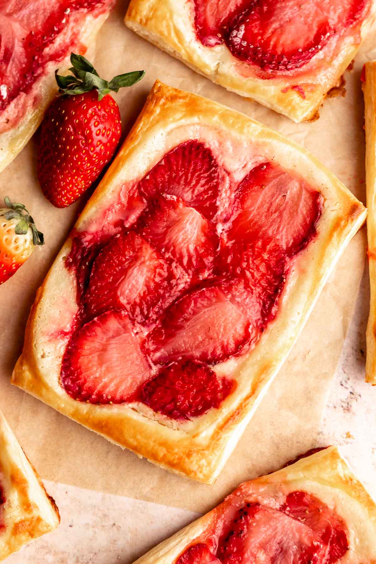 Super close up of a strawberry cream cheese danish.