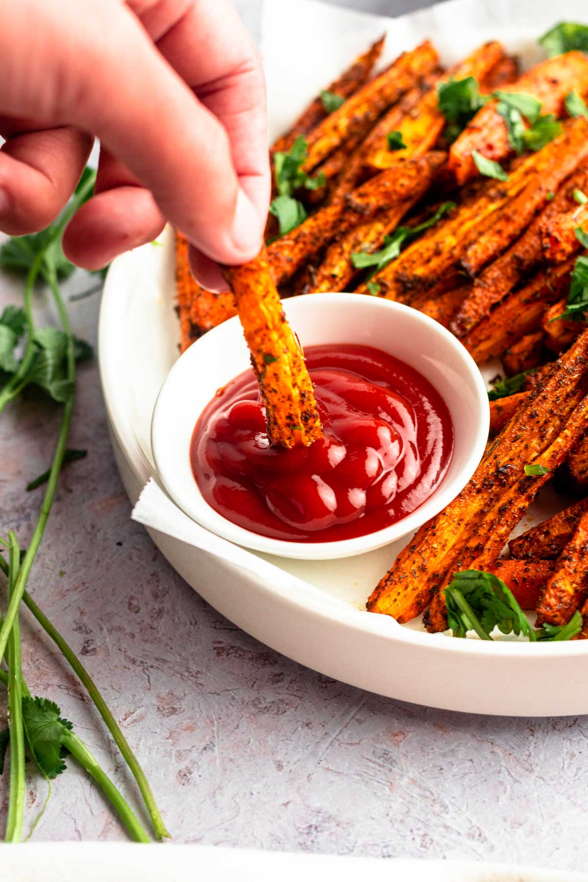 Air fryer carrot dipped in tomato sauce.