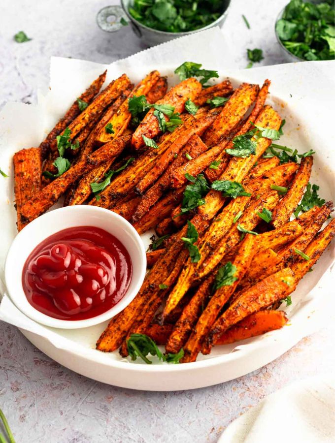 Carrot fries in a large white plate.