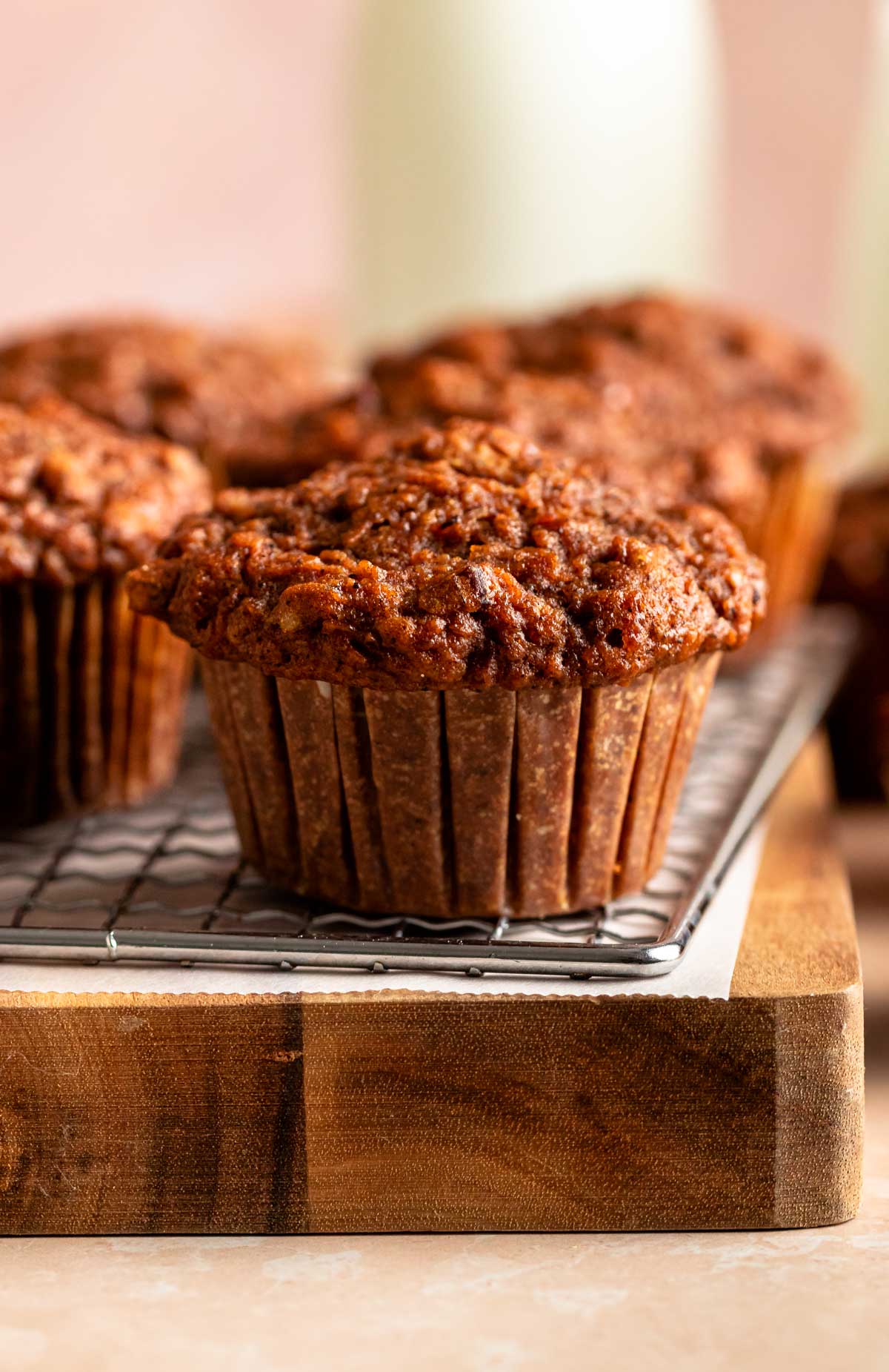 Close up shot of a muffin on a cooling rack.