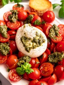 Tomato burrata salad on a plate.