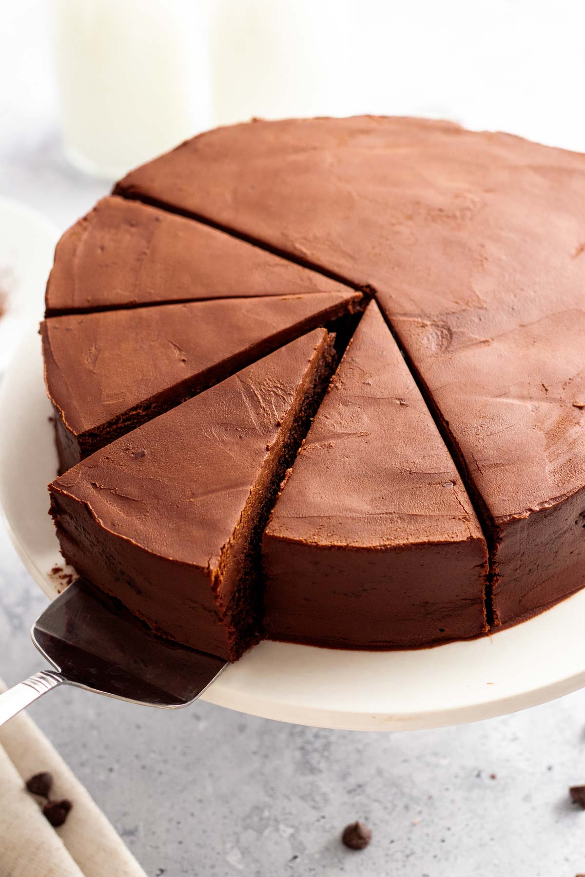 Slice pulled away from a chocolate fudge cake.