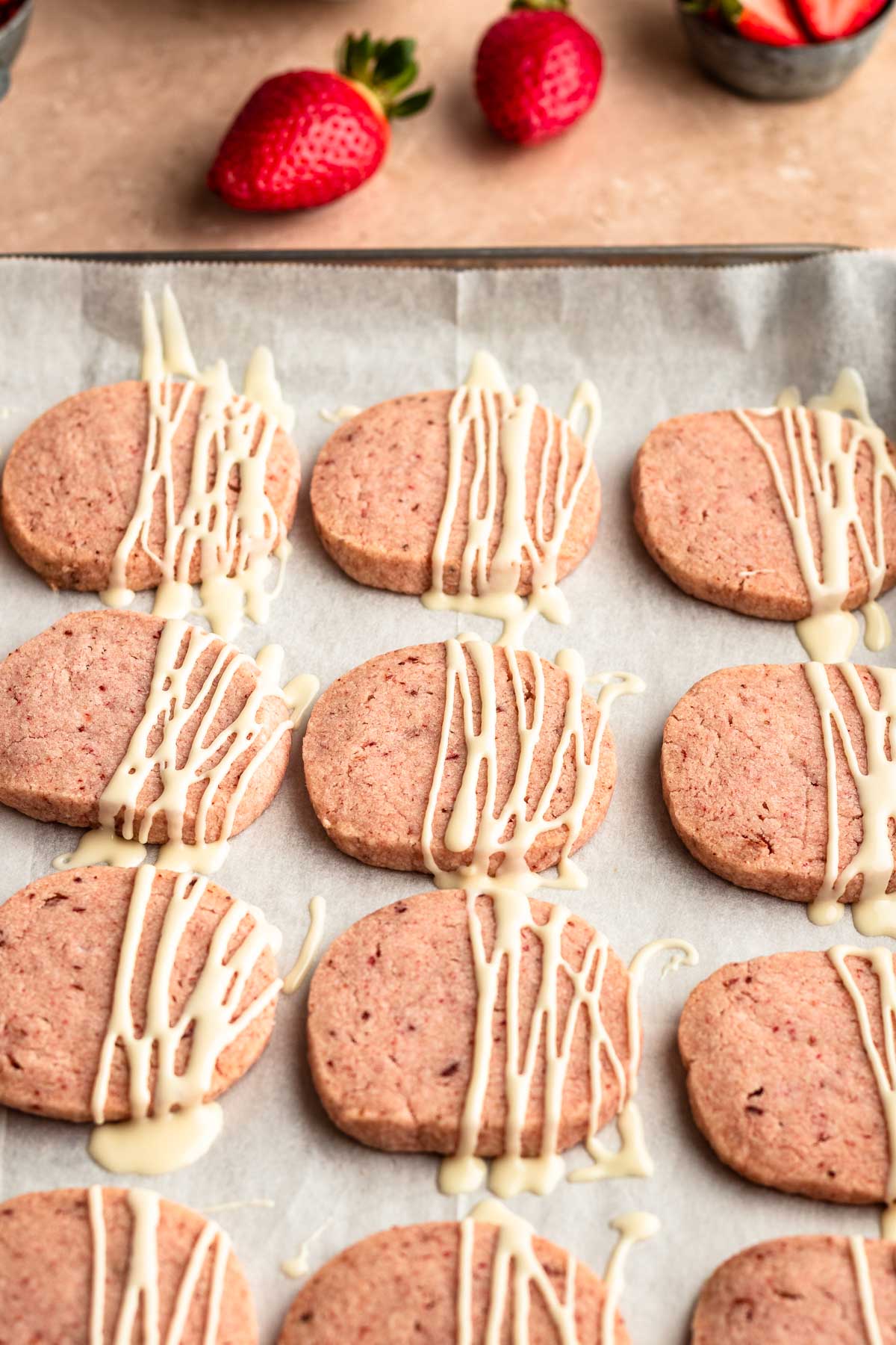 Strawberry shortbread cookies on a baking pan.