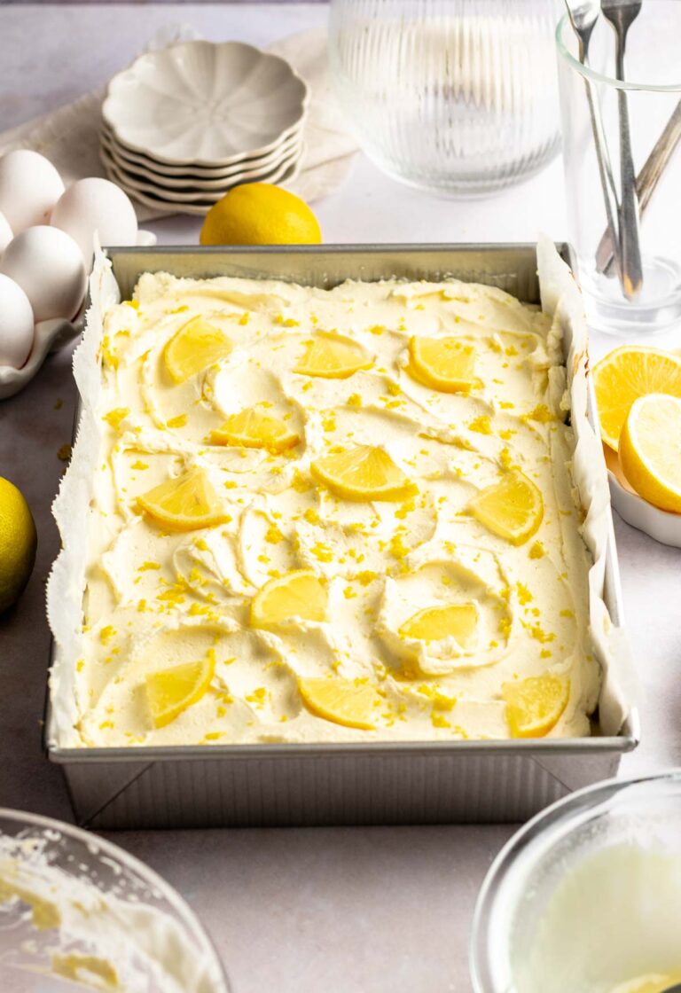 Lemon Poke Cake With Lemon Mascarpone Frosting Rich And Delish