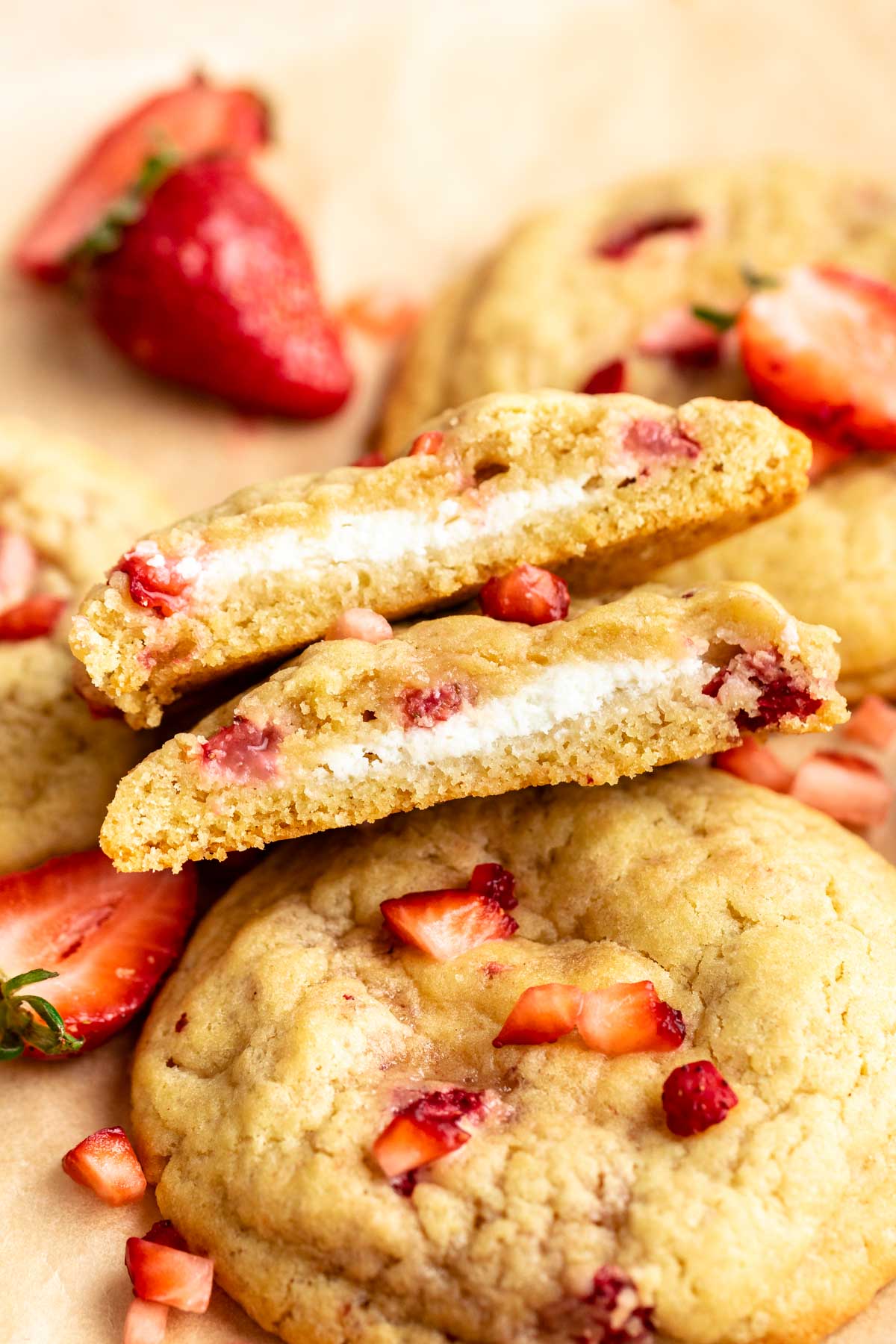 Strawberry cheesecake cookies cut in half.