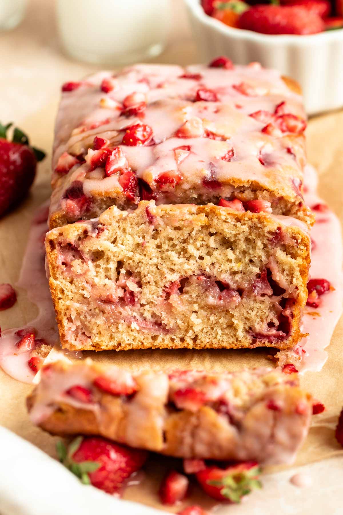 Sliced strawberry bread on a parchment paper.