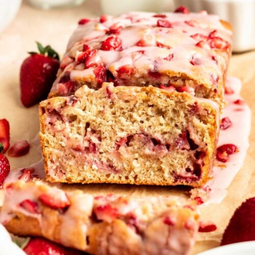 Sliced strawberry bread on a parchment paper.