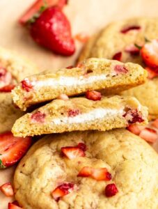 Strawberry cheesecake cookies cut in half.
