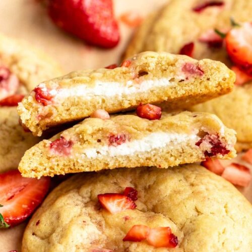 Strawberry cheesecake cookies cut in half.