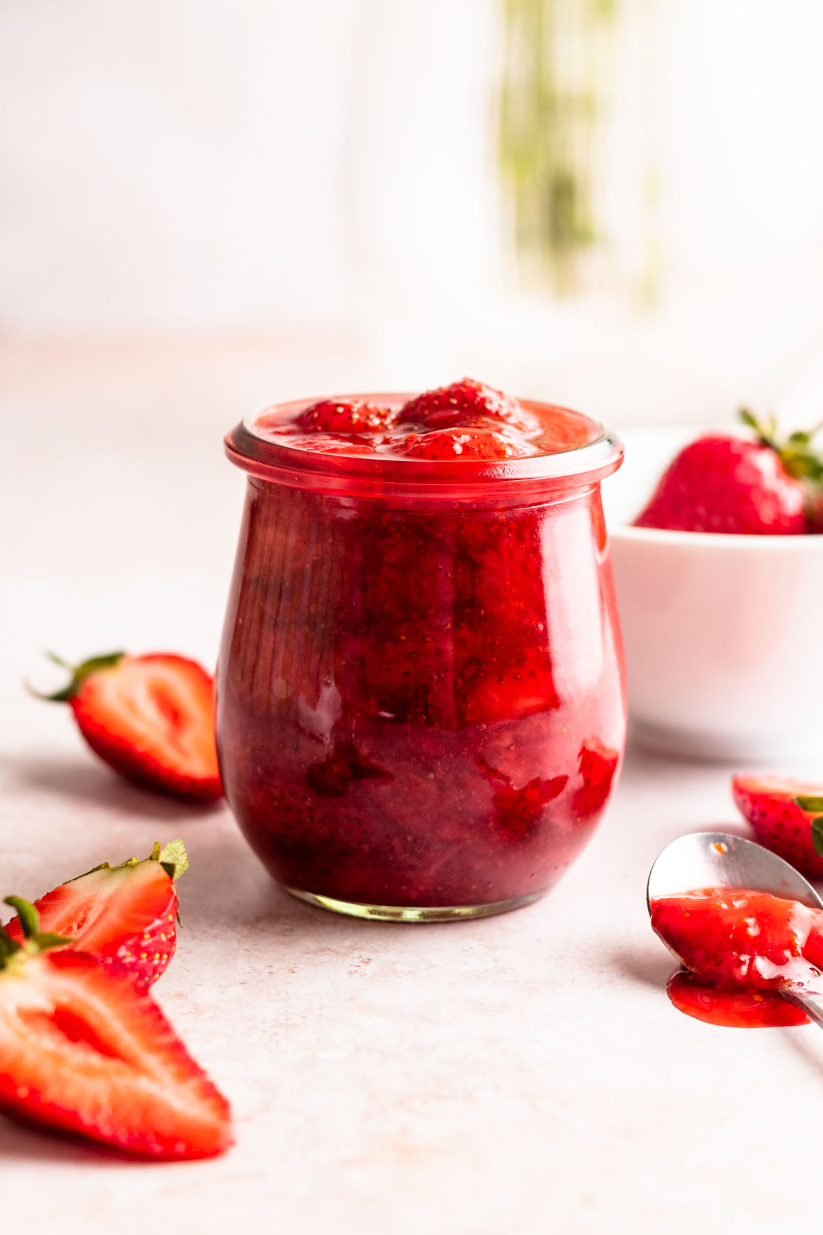 Strawberry compote in a mason jar.