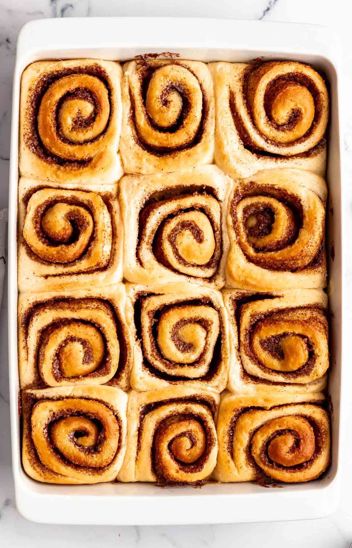 Top of baked cinnamon rolls.