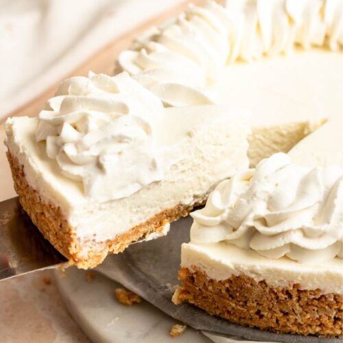 Slice of 3 ingredient no bake cheesecake pulled away from the cheesecake.