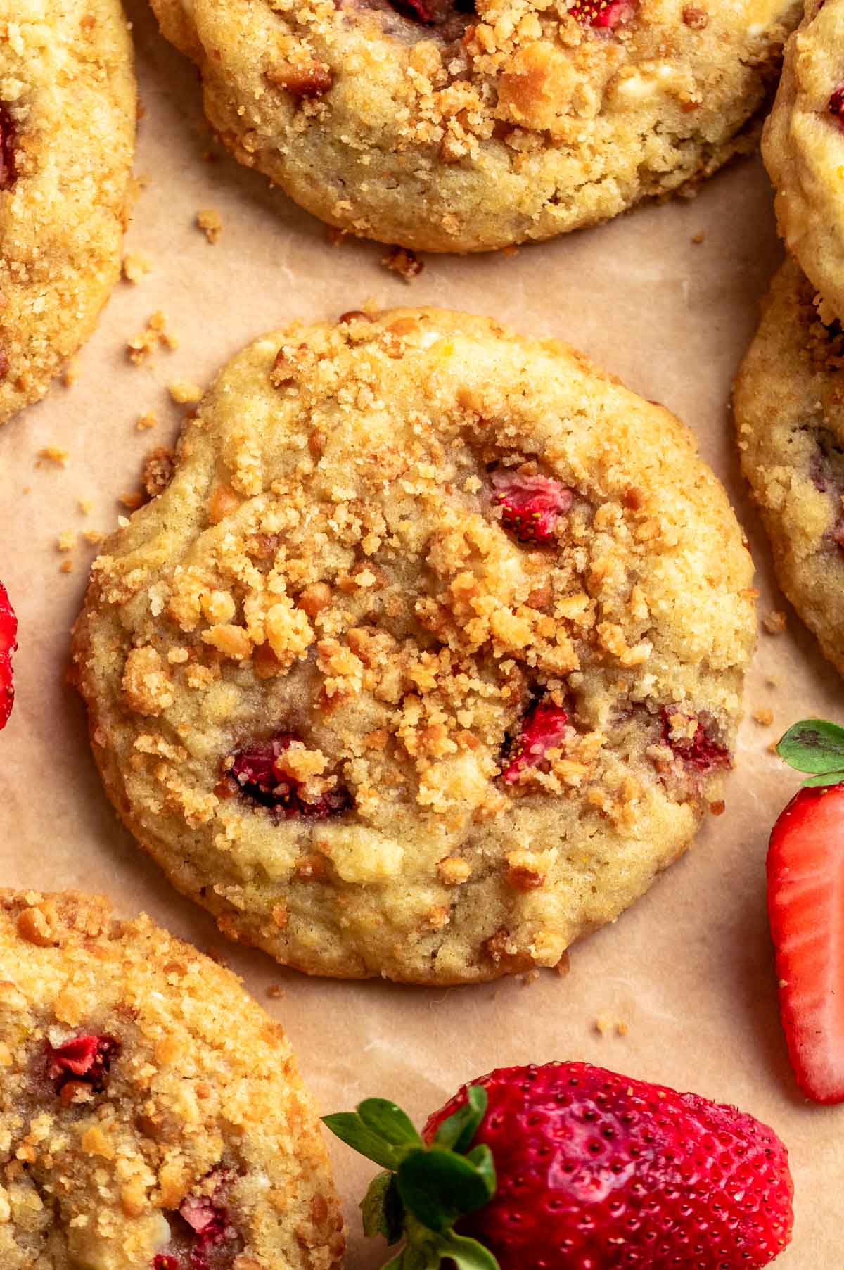 Strawberry shortcake cookies on parchment paper.