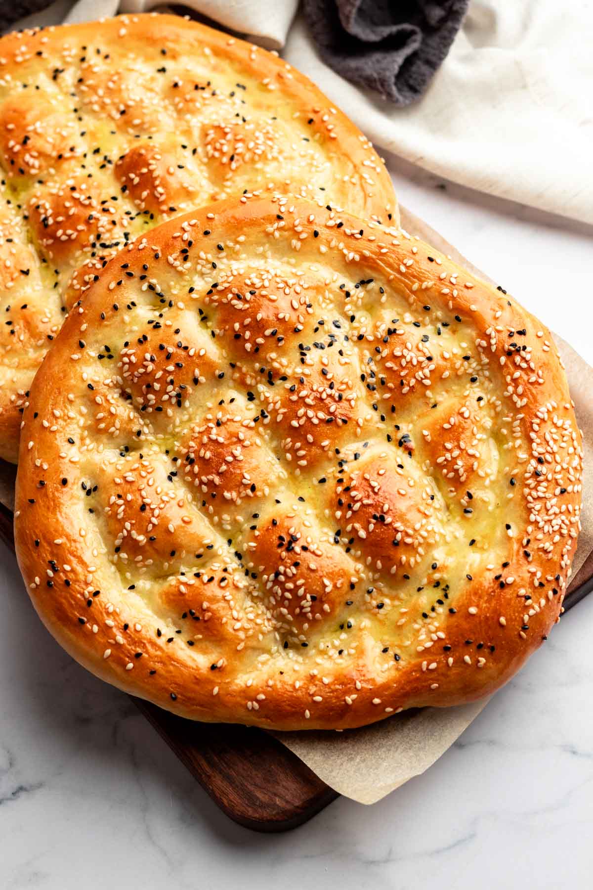 Turkish bread on a wooden board.