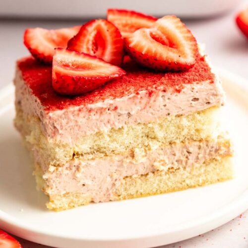 Slice of strawberry tiramisu on a white plate.