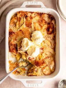 Overhead shot of 3 ingredient peach cobbler with ice cream.