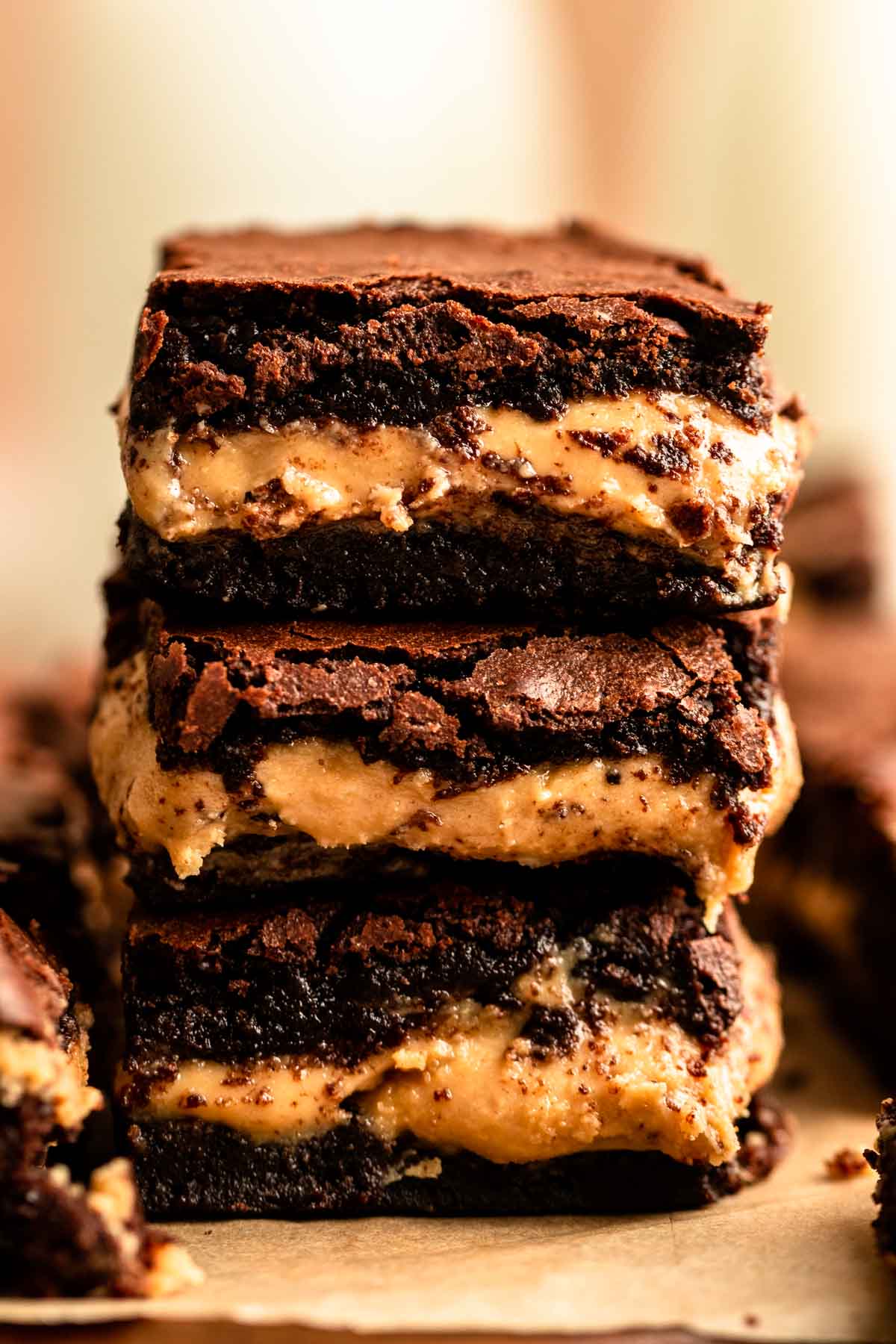 Close up shot of a stack of chocolate peanut butter brownies.