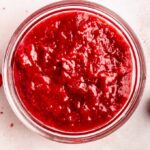 Strawberry cake filling in a small bowl.