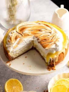 Lemon meringue cheesecake sliced open.