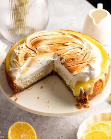 Lemon meringue cheesecake sliced open.