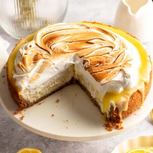 Lemon meringue cheesecake sliced open.