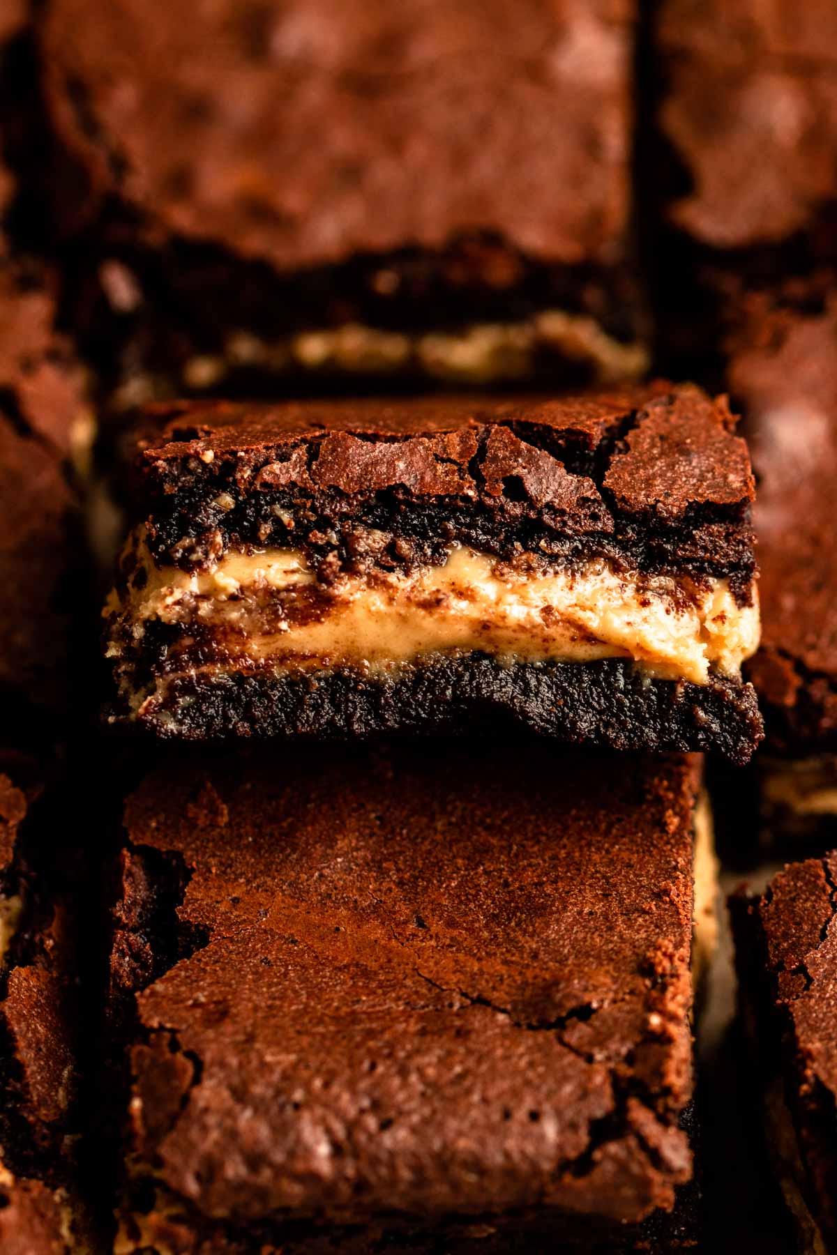 Slice of peanut butter brownie with the middle showing.