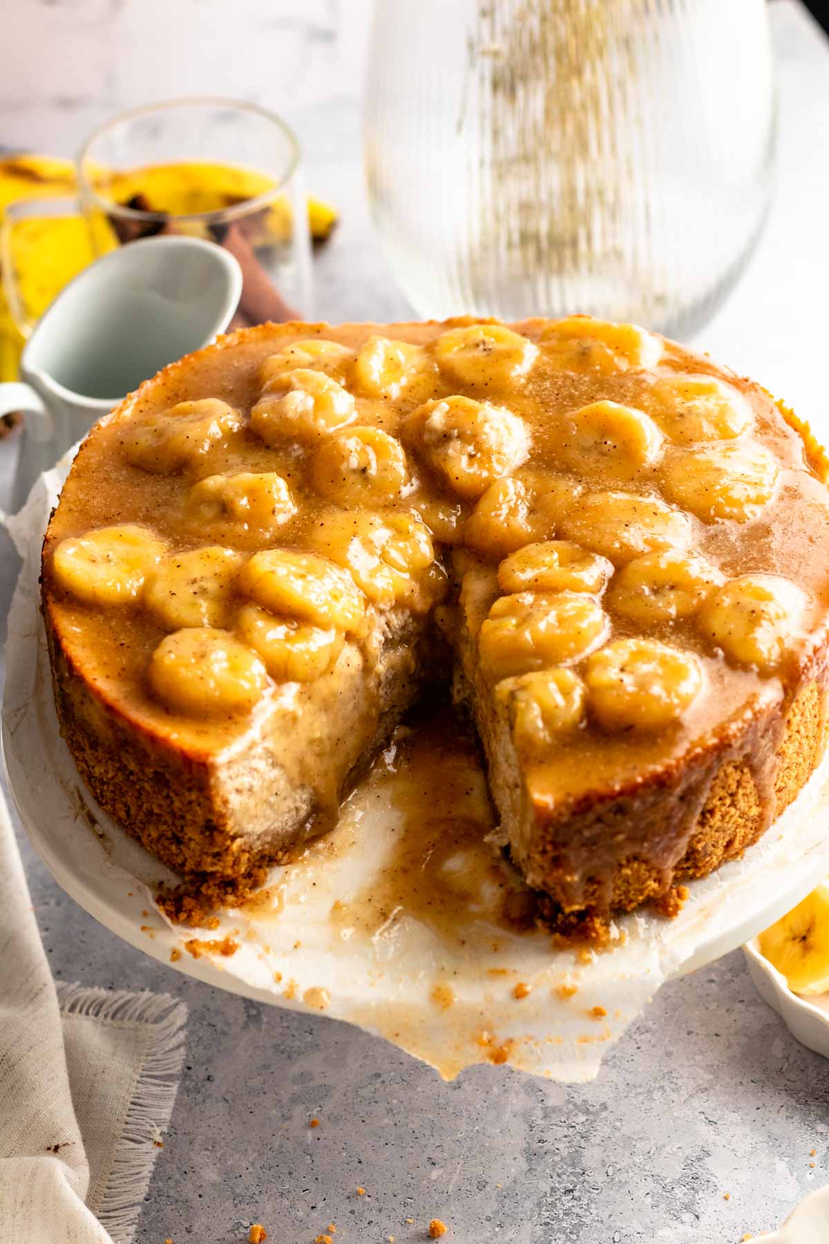 Close up shot of a cheesecake with bananas foster topping.