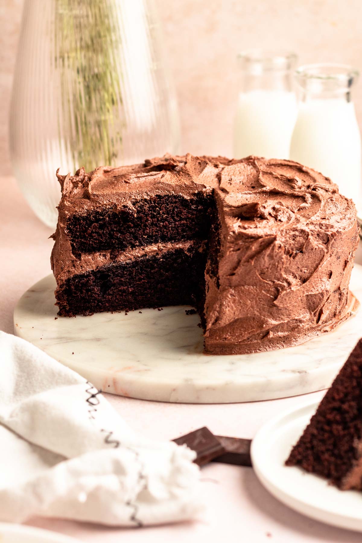 Chocolate and coffee cake with a slice missing.