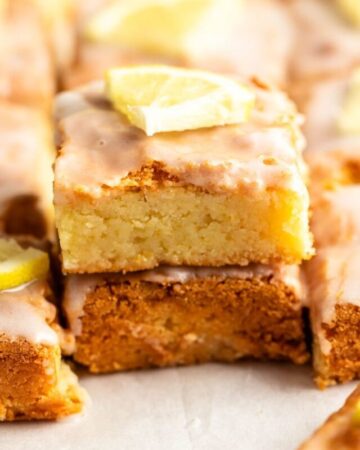 Stack of two pieces of lemon brownies.
