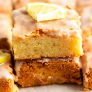Stack of two pieces of lemon brownies.