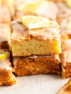 Stack of two pieces of lemon brownies.