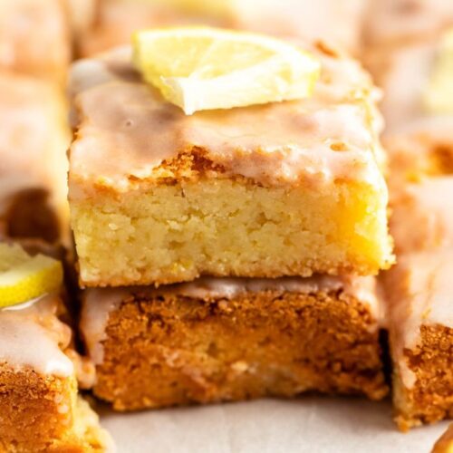 Stack of two pieces of lemon brownies.