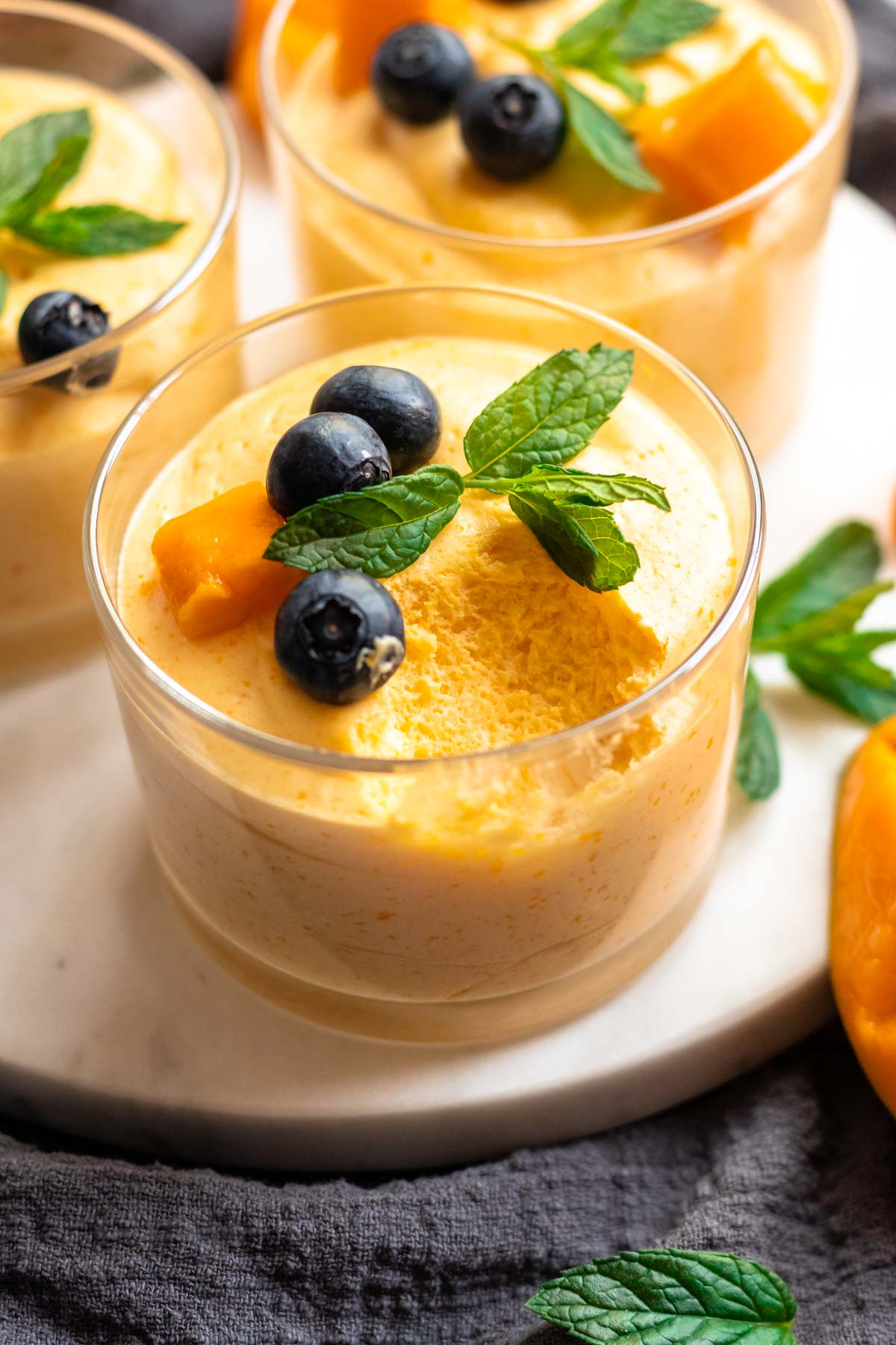 Mango mousse with a bite missing.