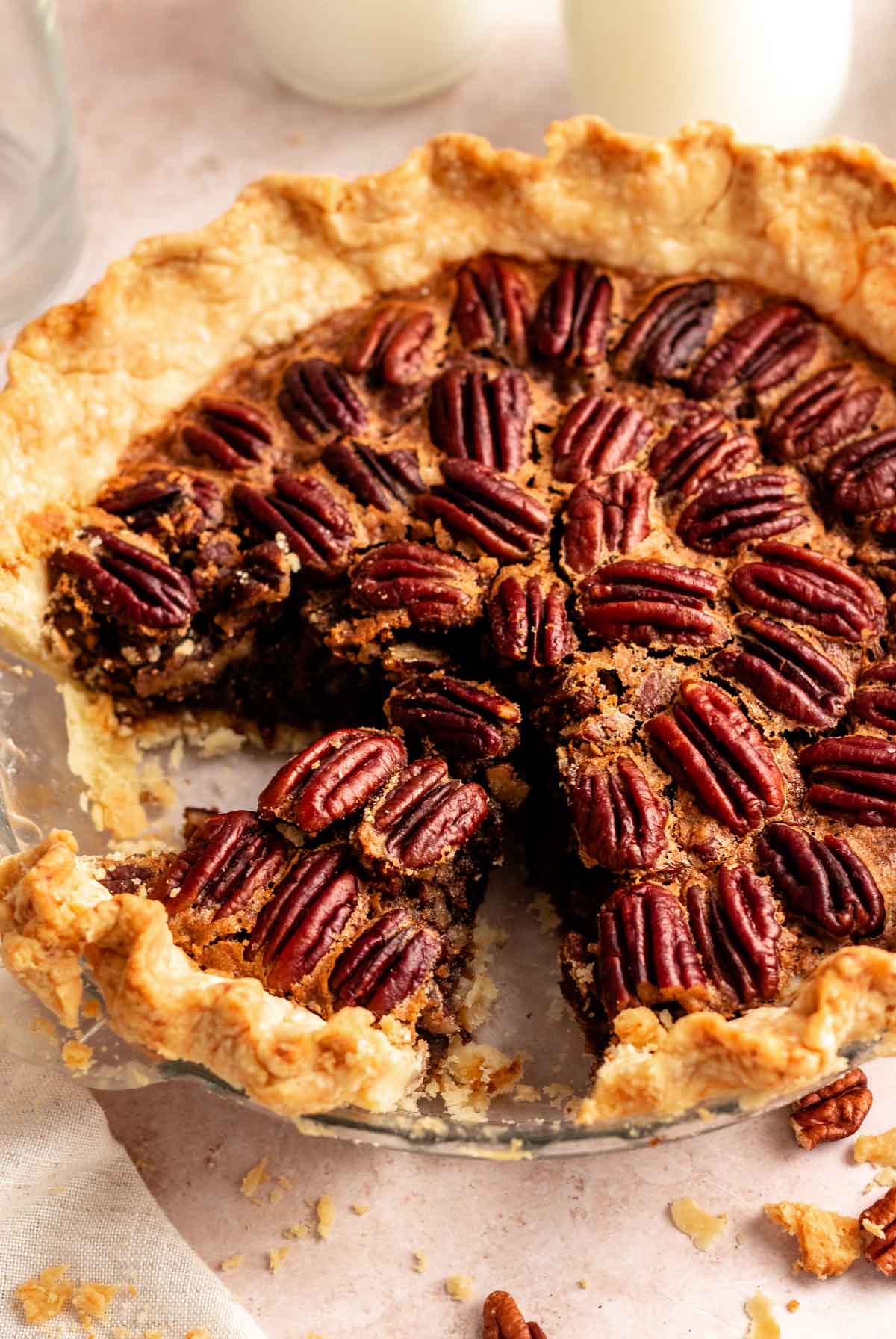Close up shot of no corn syrup pecan pie with a slice missing.
